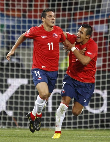 Chile's Mark Gonzalez celebrates after scoring against Switzerland