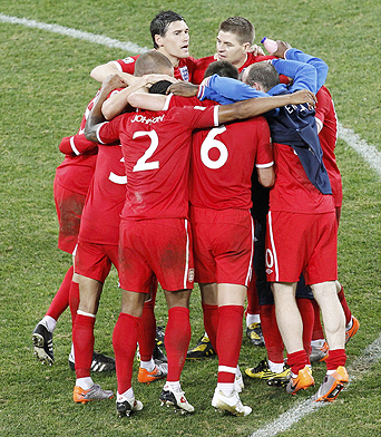 England team huddles after the 2010 World Cup Group C soccer match between Slovenia and England in Port Elizabeth