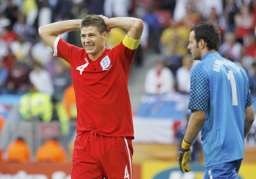 England's Steven Gerrard reacts next to Slovenia's Handanovic during 2010 World Cup Group C soccer match in Port Elizabeth