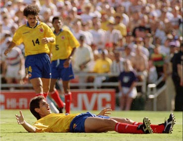 Andres Escobar reacts after scoring an own goal