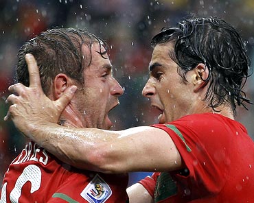 Portugal's Raul Meireles (left) celebrates with team mate Tiago after scoring a goal