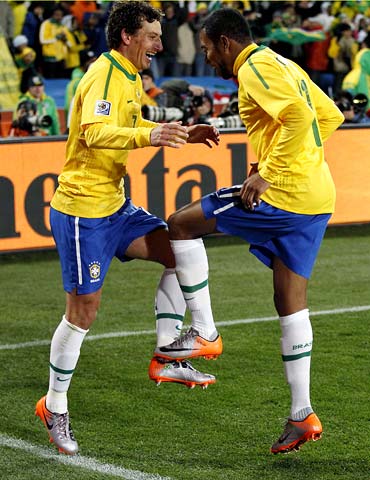 Brazil's Elano (left) celebrates his goal with team mate Robinho
