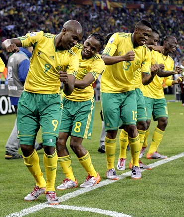Siphiwe Tshabalala (No. 8) dances with team mates after scoring against Mexico