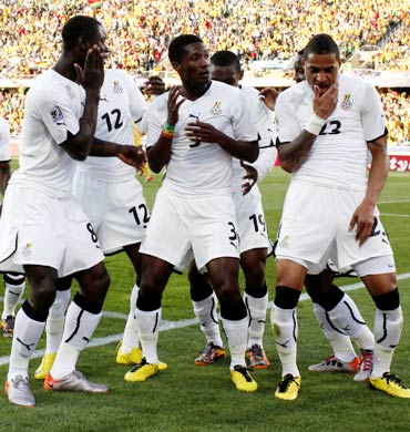 Ghana's Asamoah Gyan (No. 3) celebrates his goal with team mates