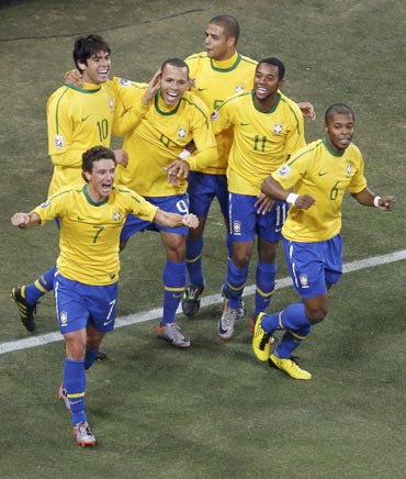 Brazilian players celebrate after a goal