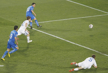 Italy's Antonio Di Natale shoots to score their first goal during their 2010 World Cup Group F soccer match