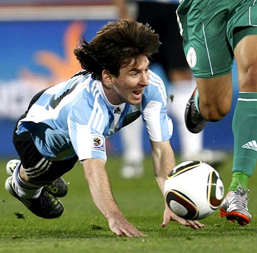 Lionel Messi falls to the ground