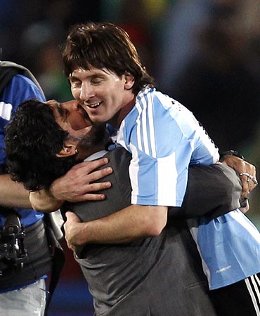 Diego Maradona hugs Lionel Messi