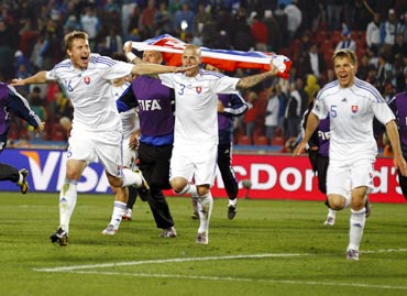 Slovakia's players celebrate their victory against Italy