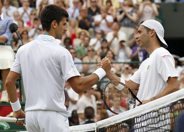 Serbia's Novak Djokovic shakes hands with Spain's Albert Montanes
