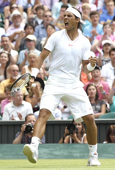 Rafa Nadal reacts after beating Philipp Petzschner