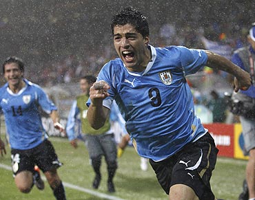 Luis Suarez celebrates after scoring the winning goal