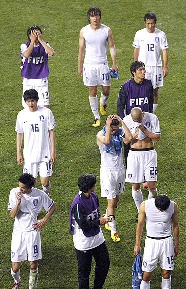 South Korean players after losing to Uruguay