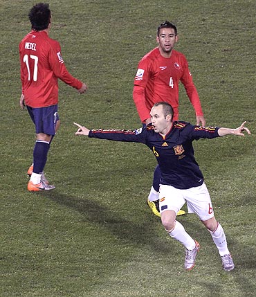 Spain's Andres Iniesta (right) celebrates after scoring against Chile