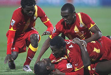 Ghana players celebrate after winning their match against USA