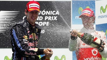Sebastian Vettel celebrates with Jeson Button