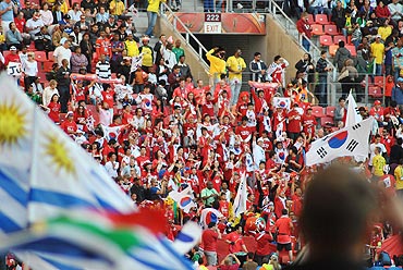 South Korean fans wave their flags
