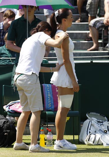 Jelena Jankovic recieves medical attention during her match