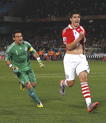 Paraguay's Cardozo celebrates after scoring the winning penalty after a penalty shootout