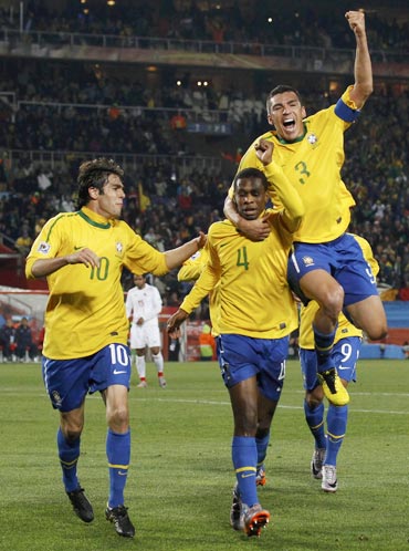 Juan celebrates after scoring the opening goal for Brazil
