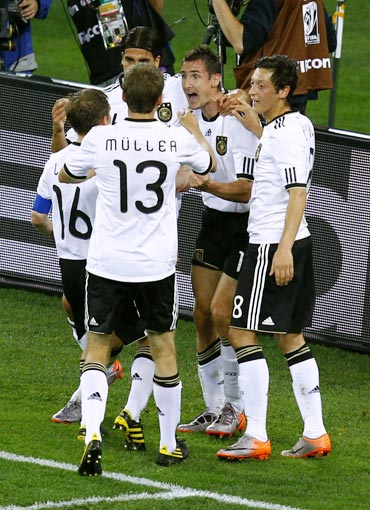 Klose celebrates with team-mates
