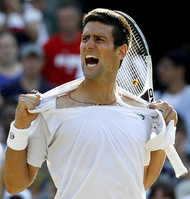 Novak Djokovic celebrates after beating Lleyton Hewitt