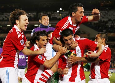 Paraguay's Cardozo celebrates after scoring the winning penalty