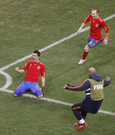 David Villa celebrates after scoring against Portugal