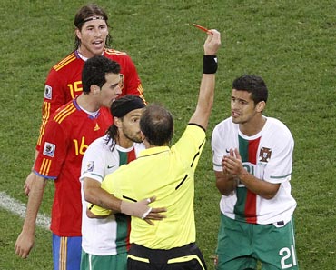 Portugal's Ricardo Costa is shown the red card by referee Hector Baldassi