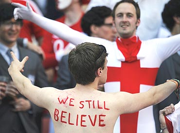 England fans sing before the match against Slovenia