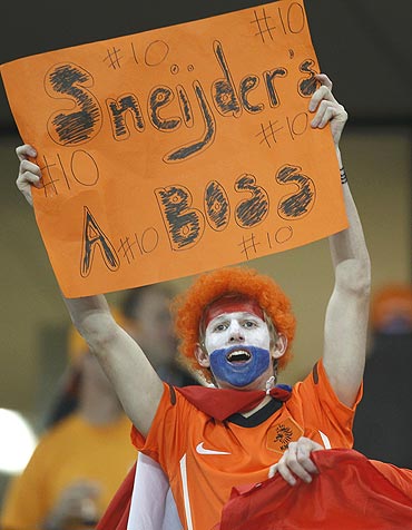 A Dutch fan cheers for Wesley Sneijder