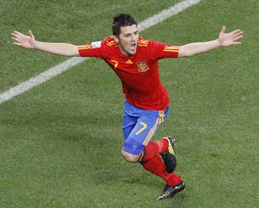 David Villa celebrates after scoring against Portugal