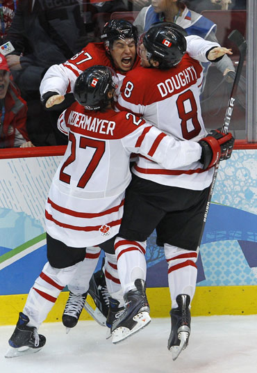 Canada's Sidney Crosby celebrates after scoring the winning goal against the US