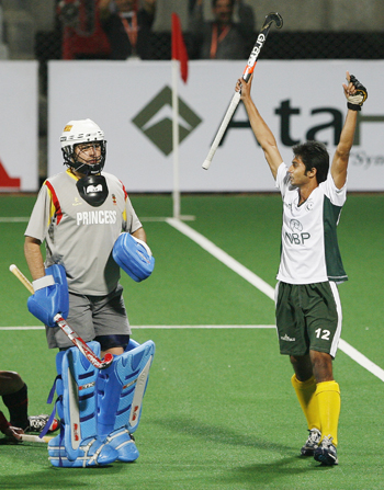 Pakistan's Abdul Haseem Khan celebrates after scoring the first goal as Spain's goal keeper Cortes watches during their match