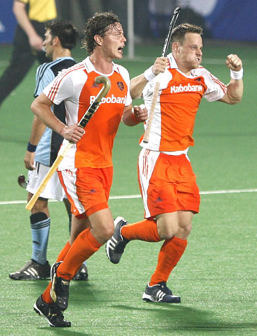 The Netherlands' Taeke Taekema (right) celebrates with team-mate Geert-Jan Derikx after scoring the third goal