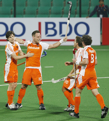The Netherlands' defender Taeke Taekema celebrates with his team mates after scoring the team's second goal