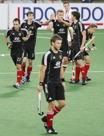 Germany's players celebrate their sixth goal during their match against Canada at the men's Hockey World Cup