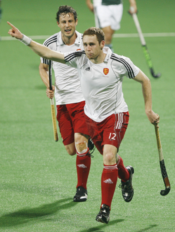 England's Clarke celebrates with his team mate Moore after scoring the team's first goal during their match