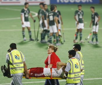 England's Mantell is carried on a stretcher after he got injured during their match against Pakistan