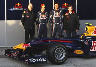 Red Bull team with the car