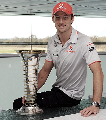 Jenson Button with the Formula One trophy