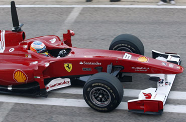 Fernando Alonso drives Ferrari