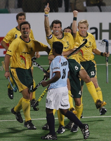 South Africa's captain Austin Smith (5) celebrates with his team-mates after scoring the third goal