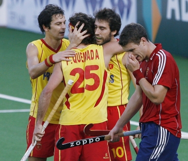 Spanish players react after their win against England