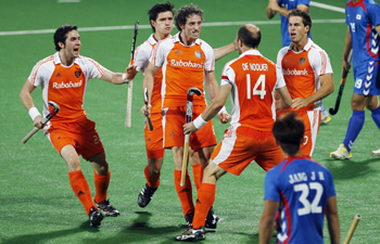 The Netherlands' Ronald Brouwer celebrates with his teammates after scoring the first goal during their match against South Kore