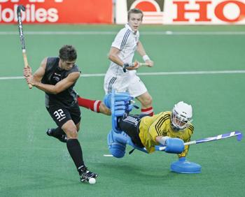 New Zealand's Wilson scores a goal as Germany's goalkeeper Jessulat unsuccessfully attempts to stop it