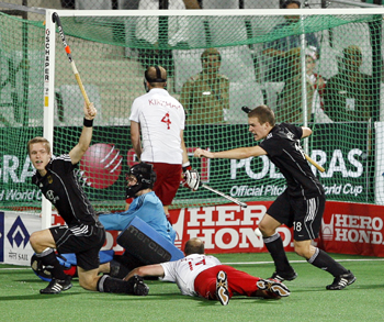 Germany's Linus Butt (left) and team mate Oliver Korn (right) celebrate after Butt scored a goal against England