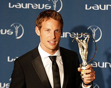 British Formula One driver Jenson Button poses with his Breakthrough of the Year award