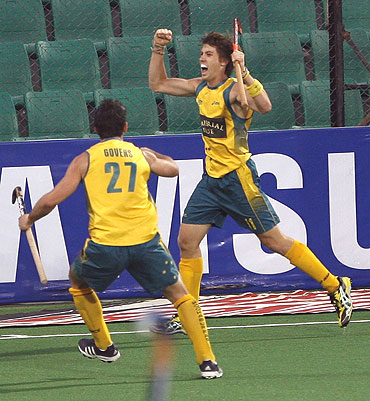 Australia's Eddie Ockenden celebrates with team-mate Kieran Govers (left) after scoring the first goal
