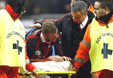 David Beckham taken off the field on a stretcher